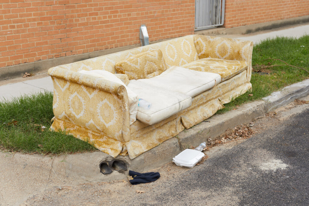 Couch left on a sidewalk